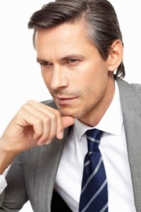 Man Touching Chin - Anderson Sobel Cosmetic Surgery