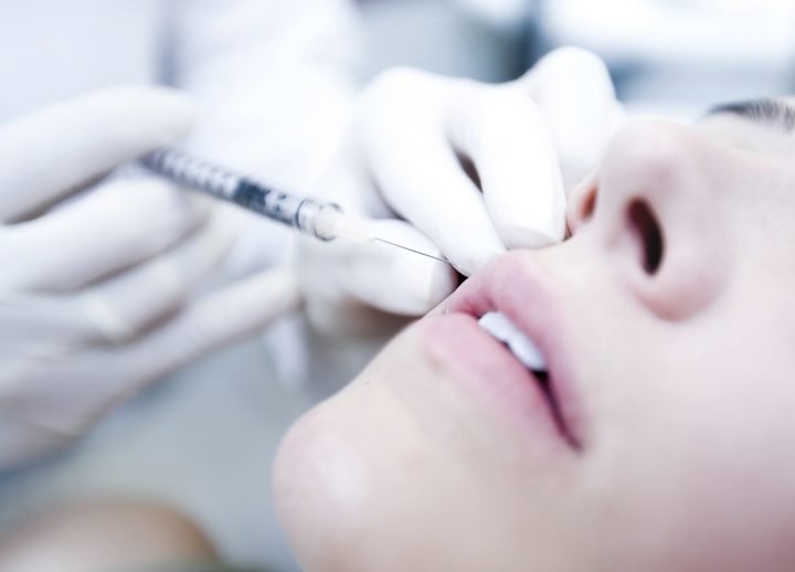 Women receiving Botox injections around the mouth area.  