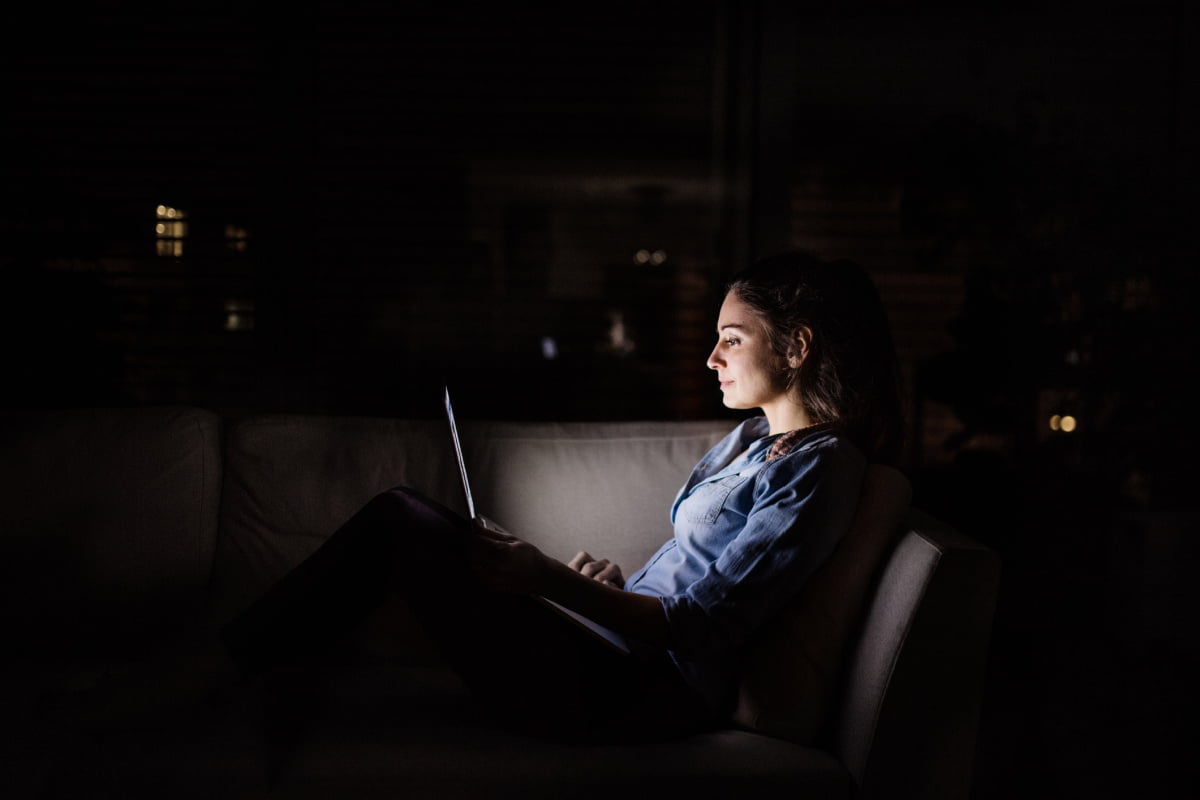 Woman Checking Email on Computer After hours at Home