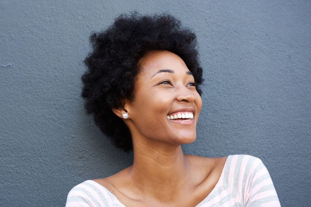 Smiling woman with graceful neck contours