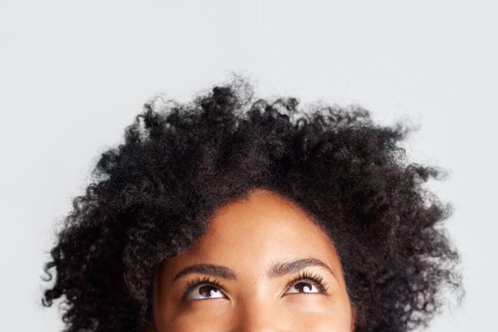 Woman looking up at forehead