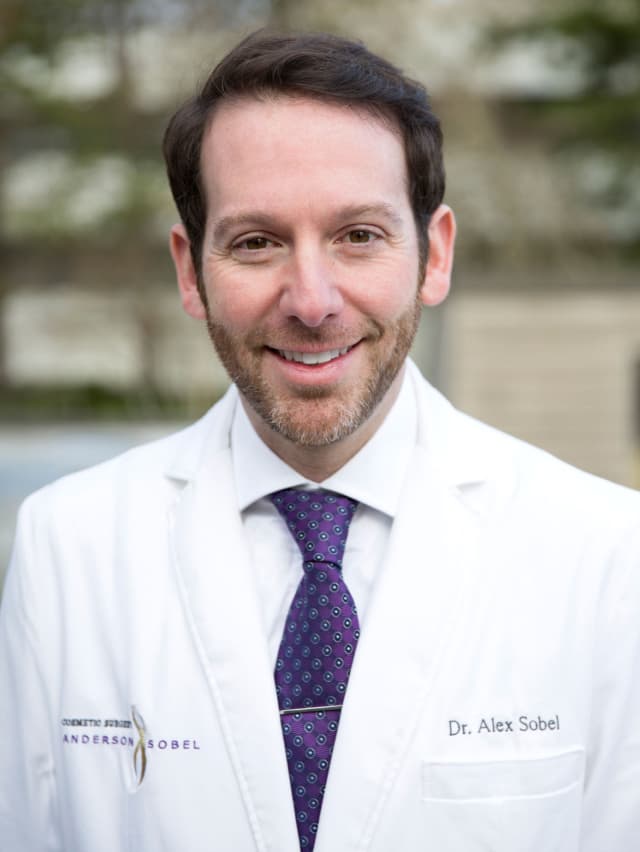 Portrait of Seattle Cosmetic Surgeon Dr. Alexander Sobel smiling