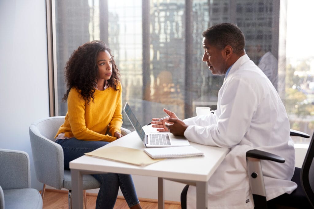 Cosmetic surgeon telling potential patient that he won't do her desired procedure during a consultation