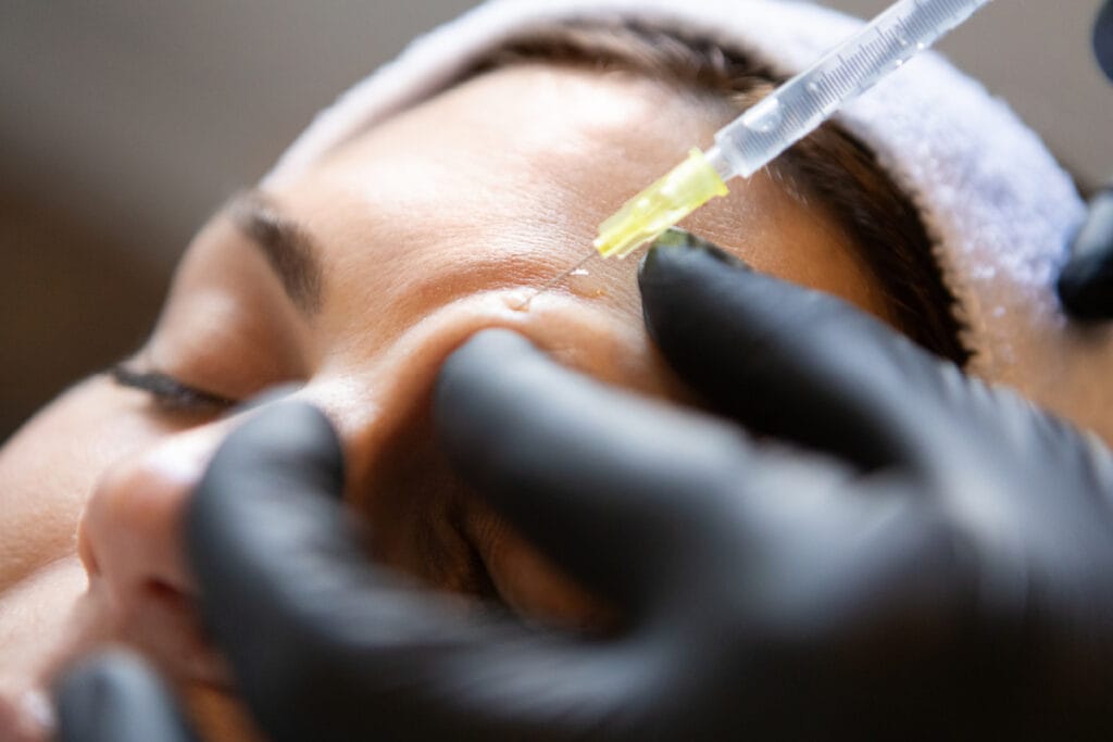 Woman with thick skin getting Botox injections