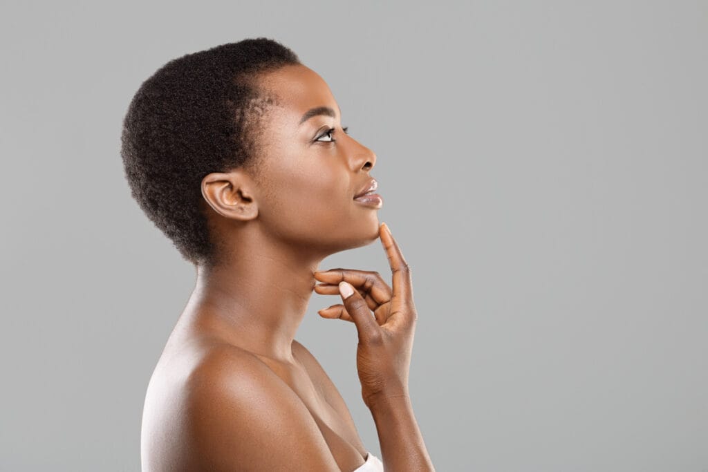 Portrait of African American woman from the side touching her chin